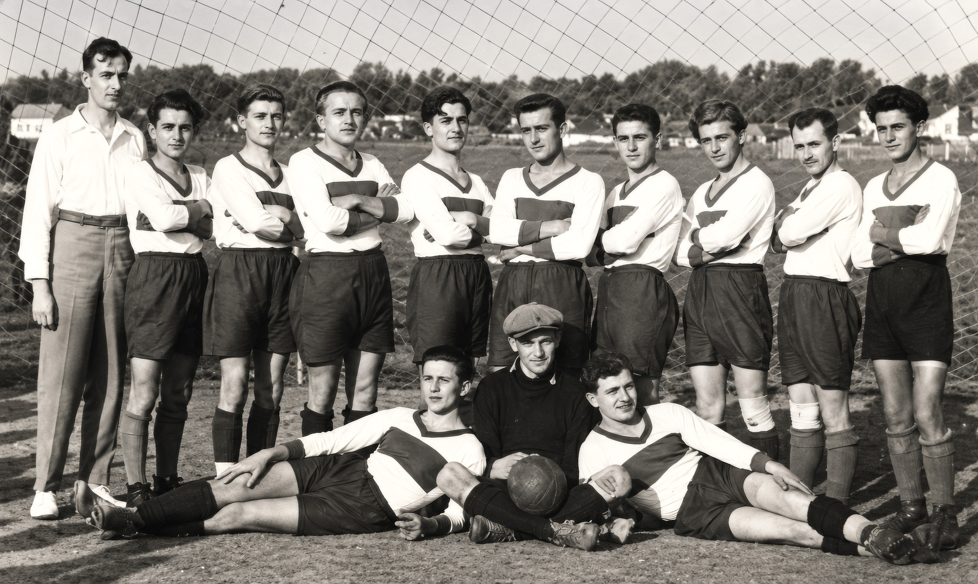 Young Eugen Suchoň as goalkeeper in a group photograph of the Pezinok football team